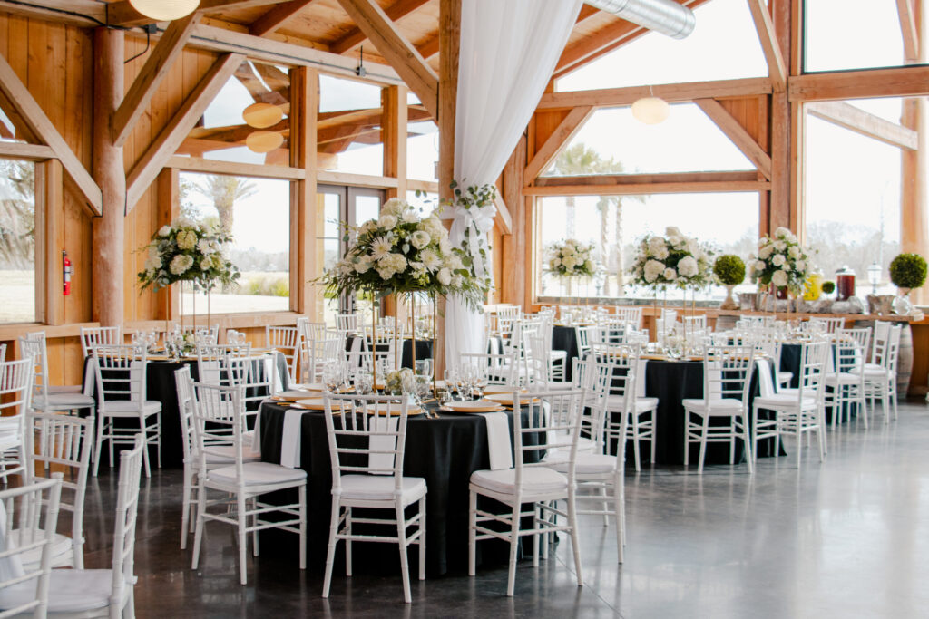 Wedding reception tables in the main hall of The Barn at Cottonwood Ranch