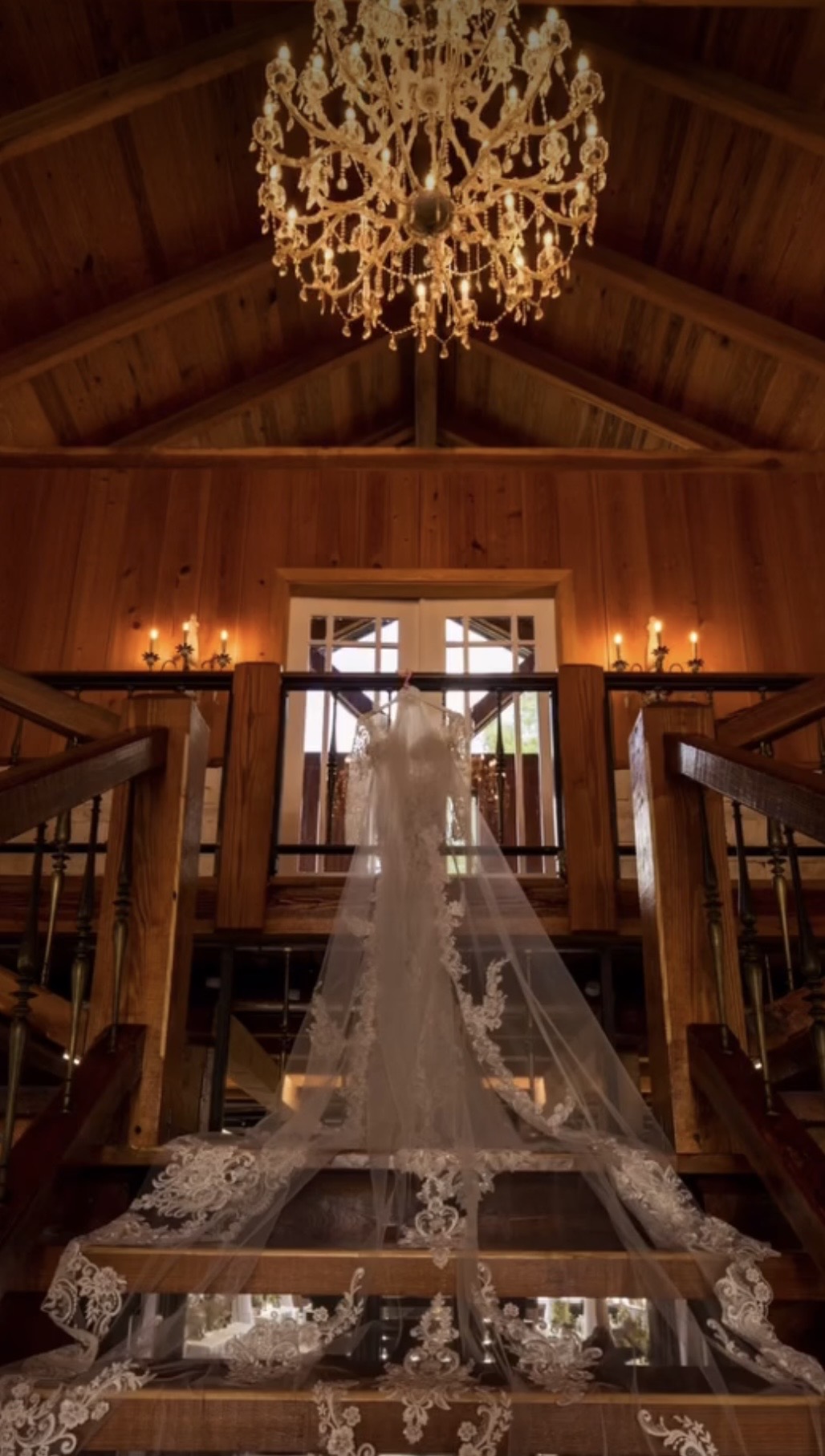 Wedding veil under the chandelier inside The Barn at Cottonwood Ranch