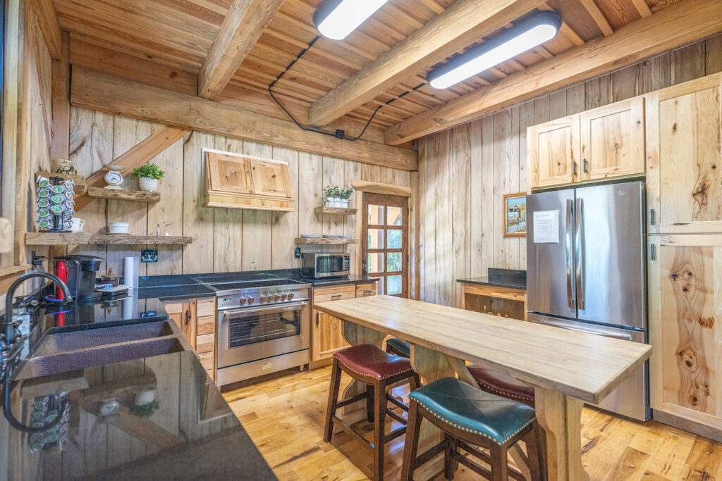 Rustic wood kitchen in the lounge at The Barn at Cottonwood Ranch