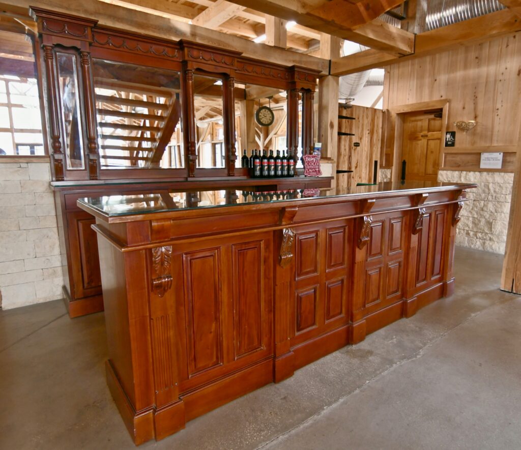 Custom wood bar inside The Barn at Cottonwood Ranch