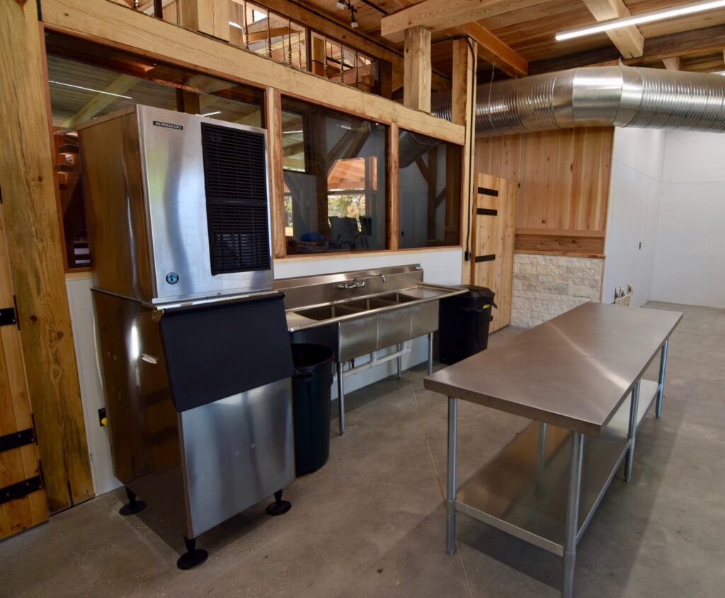 Catering kitchen with ice machine and stainless steel prep table