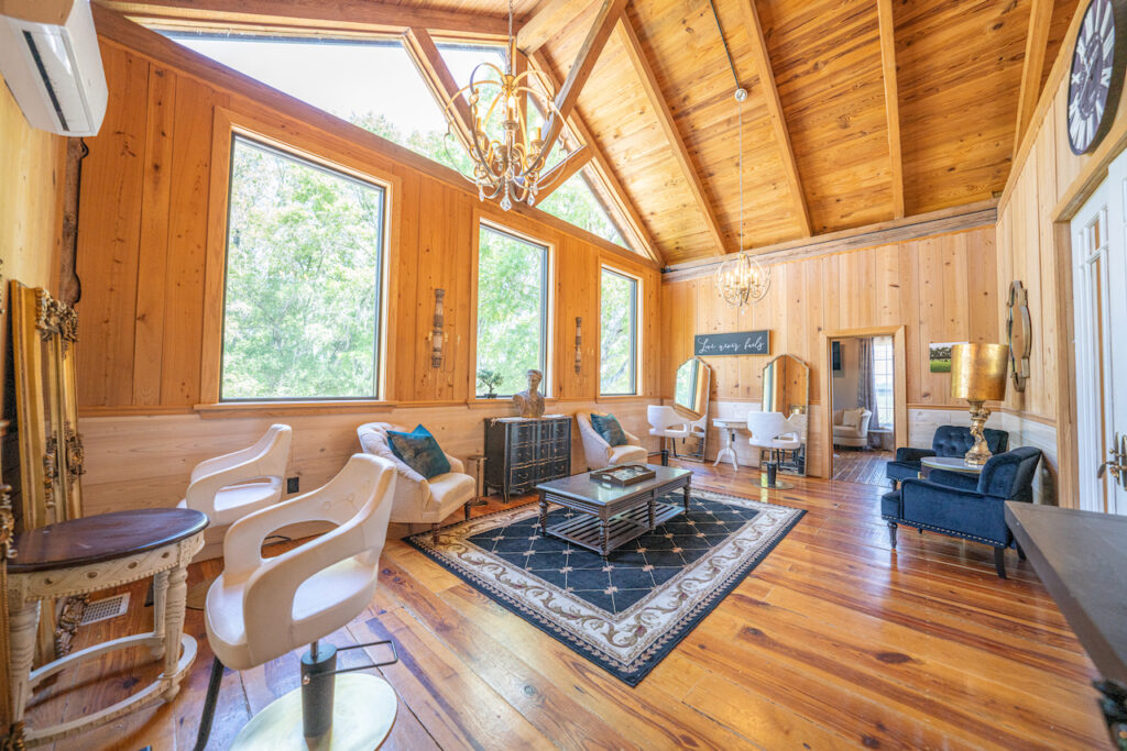 Bridal suite lounge with seating and vaulted wood ceiling
