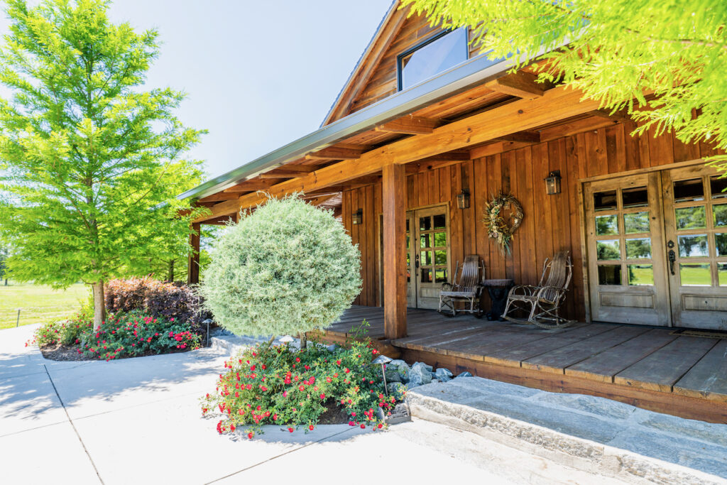 Landscaped porch entrance at Cottonwood Ranch