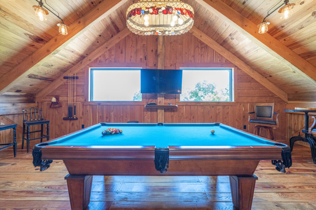 Game room with pool table at The Barn at Cottonwood Ranch